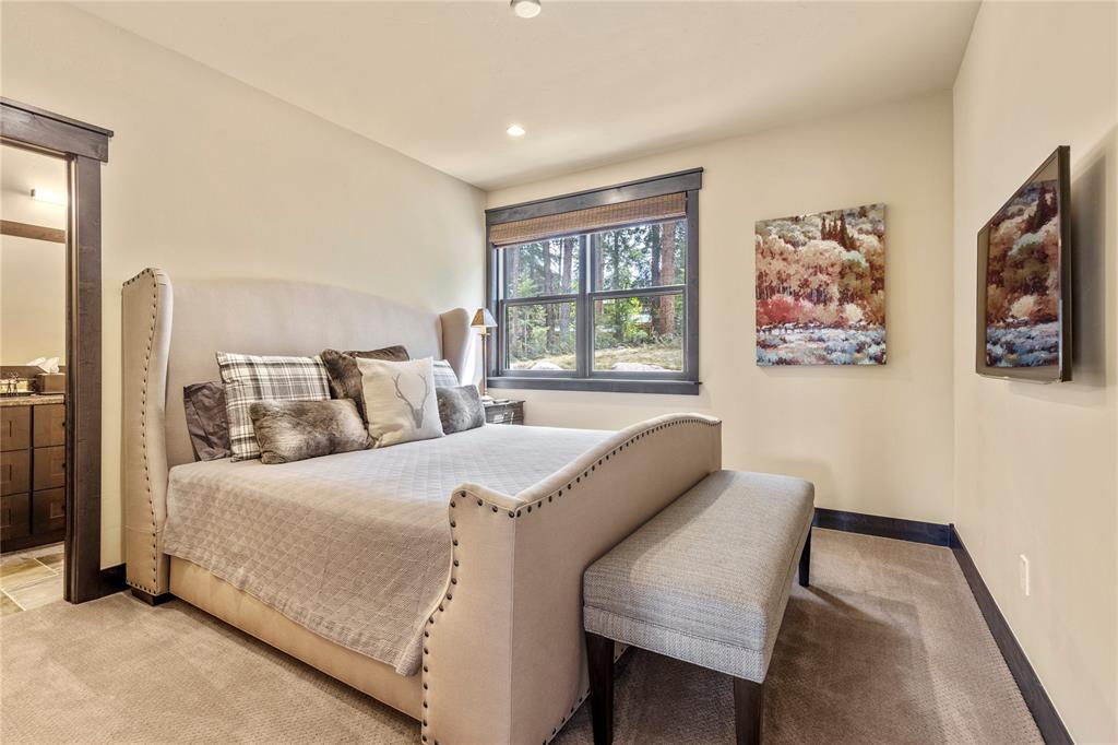 874 Independence Road, Unit 874 Keystone, CO 80435 - Photo 17 of 35 a bedroom with a bed and a large window