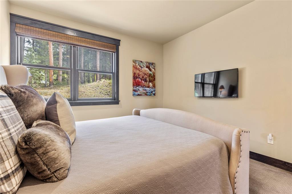 874 Independence Road, Unit 874 Keystone, CO 80435 - Photo 18 of 35 a bedroom with a bed and a large window