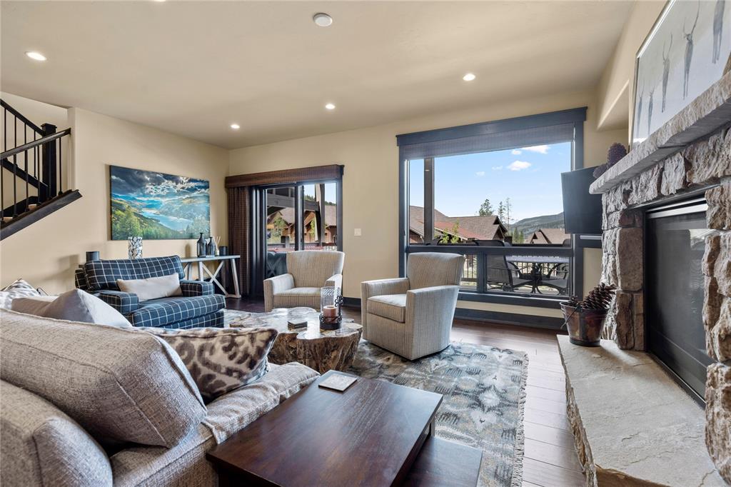 874 Independence Road, Unit 874 Keystone, CO 80435 - Photo 2 of 35 a living room with furniture a large window and a flat screen tv