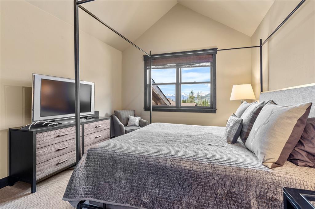 874 Independence Road, Unit 874 Keystone, CO 80435 - Photo 23 of 35 a bedroom with a bed and a flat tv screen on dresser