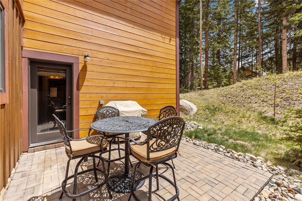 874 Independence Road, Unit 874 Keystone, CO 80435 - Photo 29 of 35 a backyard of a house with table and chairs