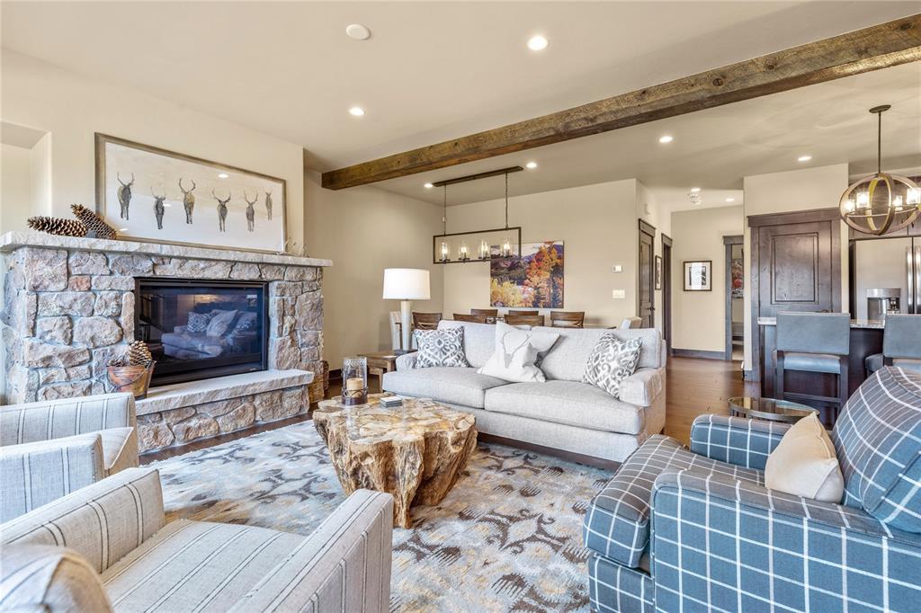 874 Independence Road, Unit 874 Keystone, CO 80435 - Photo 5 of 35 a living room with furniture a fireplace and a rug