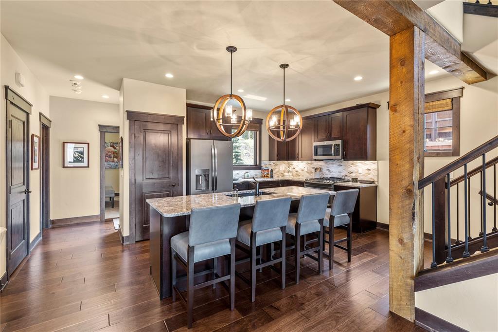 874 Independence Road, Unit 874 Keystone, CO 80435 - Photo 6 of 35 a large kitchen with a table and chairs