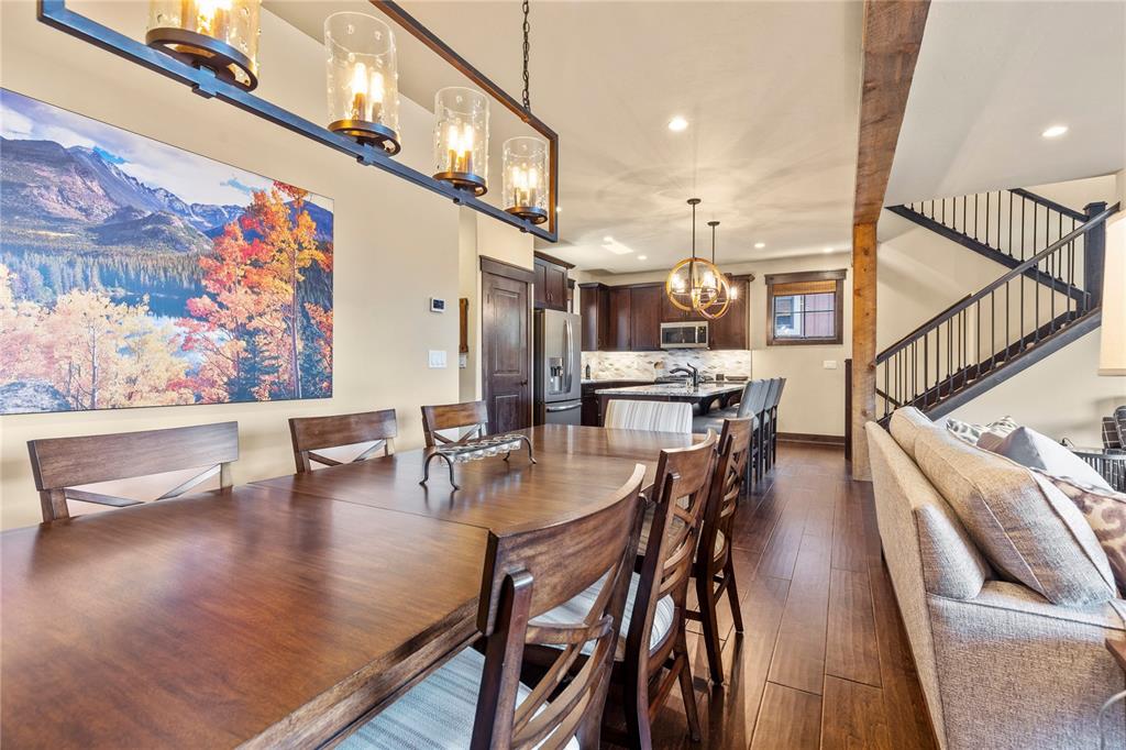 874 Independence Road, Unit 874 Keystone, CO 80435 - Photo 10 of 35 a dining room with furniture and wooden floor