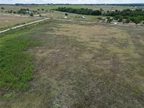 a view of a field with an outdoor space