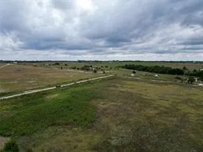 a view of a lake with houses in the back