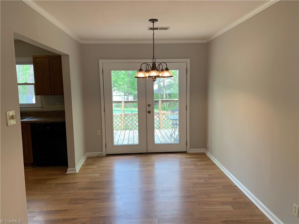 3896 Lewiston Road Summerfield, NC 27358 - Photo 6 of 16 Breakfast room features pretty french doors leading onto the deck.