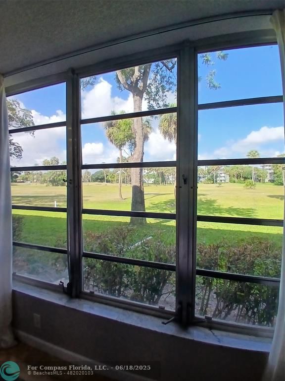 907 Cypress Terrace, Unit 104 Pompano Beach, FL 33069 - Photo 20 of 40 a view of a room with a large window