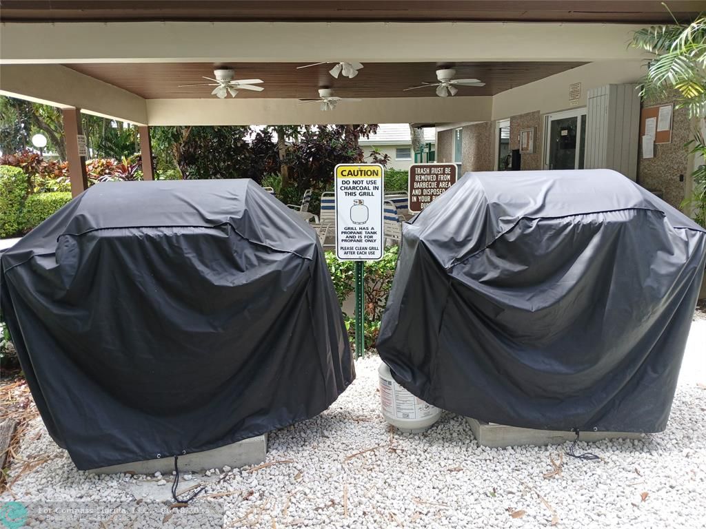907 Cypress Terrace, Unit 104 Pompano Beach, FL 33069 - Photo 35 of 40 a view of balcony with furniture and lamp