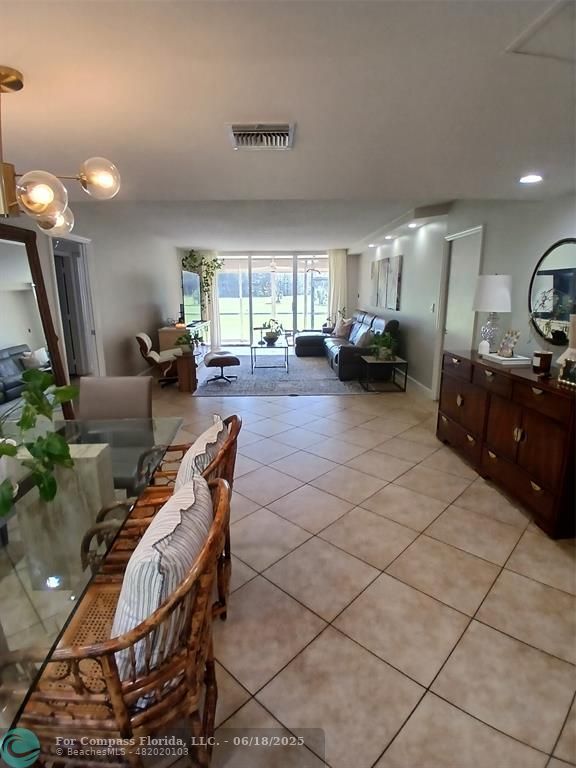 907 Cypress Terrace, Unit 104 Pompano Beach, FL 33069 - Photo 6 of 40 a view of a livingroom with furniture and a window