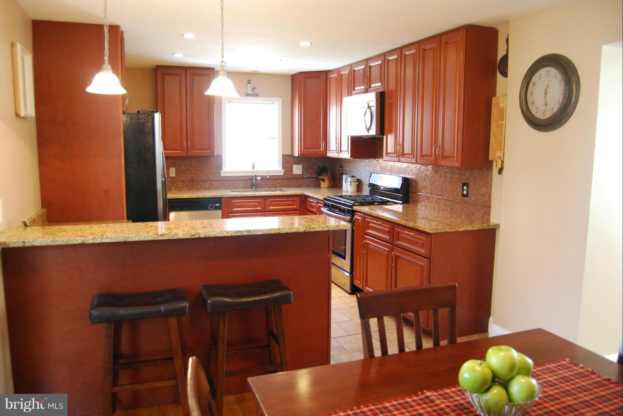 8127 Woodhaven Road Baltimore, MD 21237 - Photo 10 of 29 Kitchen w/breakfast bar (stools convey)