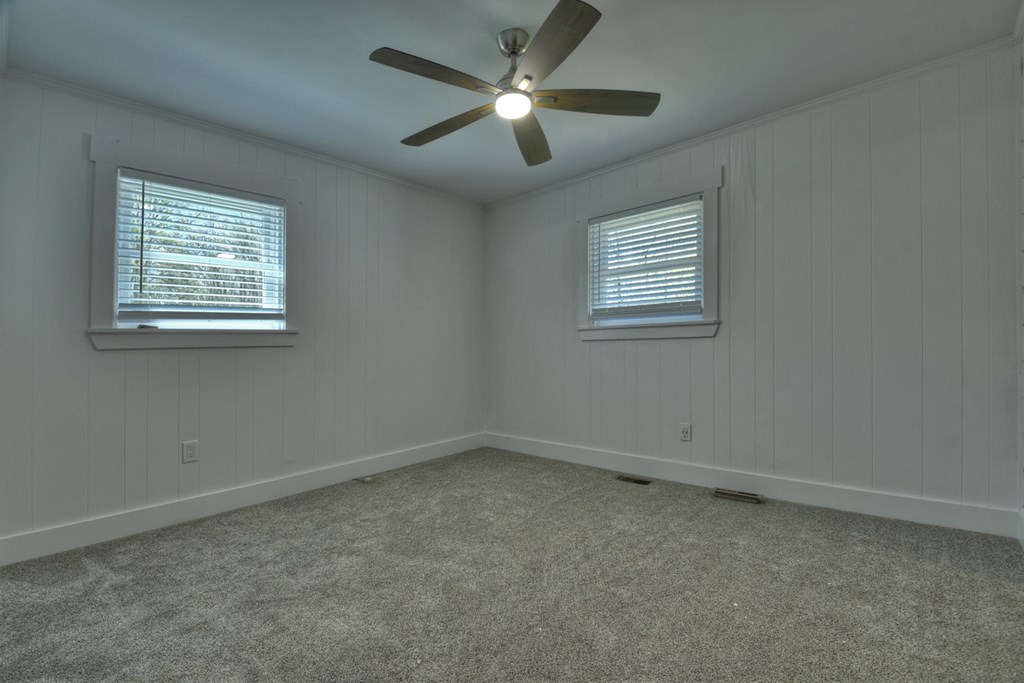 975 Goss Road Epworth, GA 30541 - Photo 24 of 59 an empty room with a window and a fan
