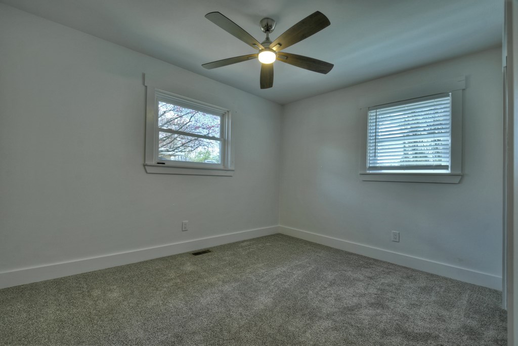975 Goss Road Epworth, GA 30541 - Photo 25 of 59 an empty room with a window and a fan