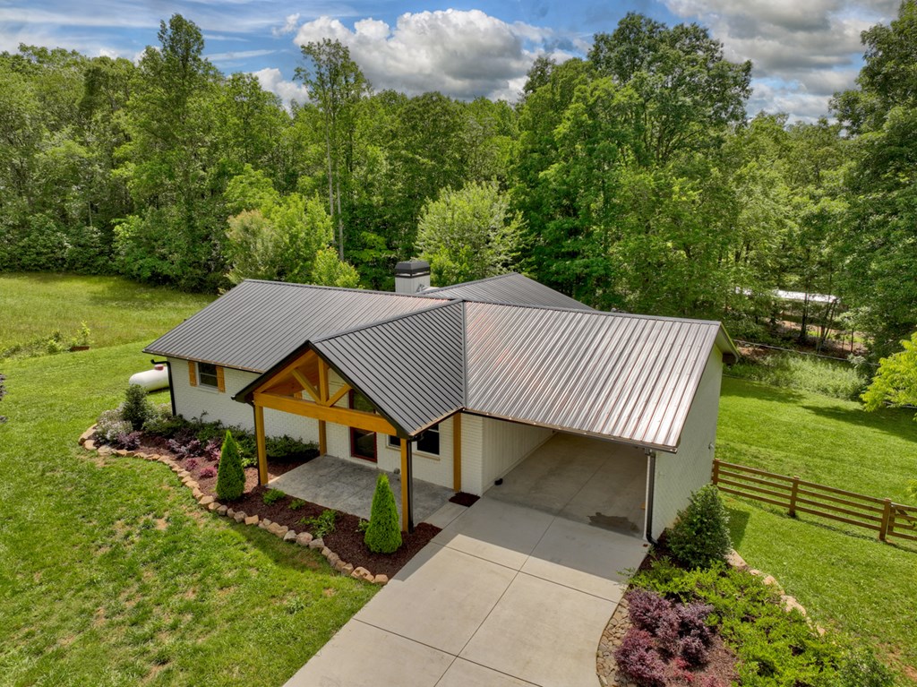 975 Goss Road Epworth, GA 30541 - Photo 3 of 59 an aerial view of a house roof deck and garden