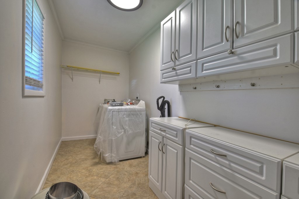 975 Goss Road Epworth, GA 30541 - Photo 33 of 59 a utility room with cabinets