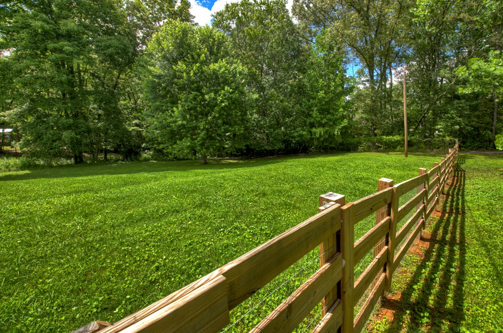 975 Goss Road Epworth, GA 30541 - Photo 6 of 59 a view of a wooden deck with a yard