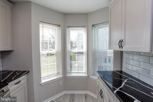 a view of an empty room with windows