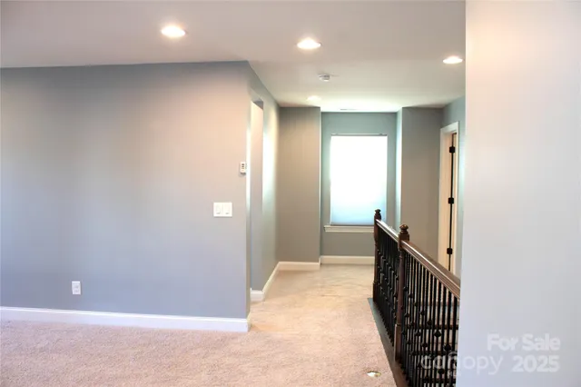 a view of a hallway with a livingroom