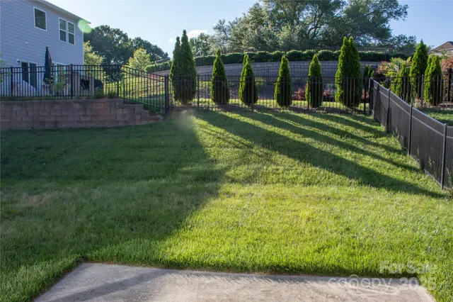 a view of a backyard with a lake view