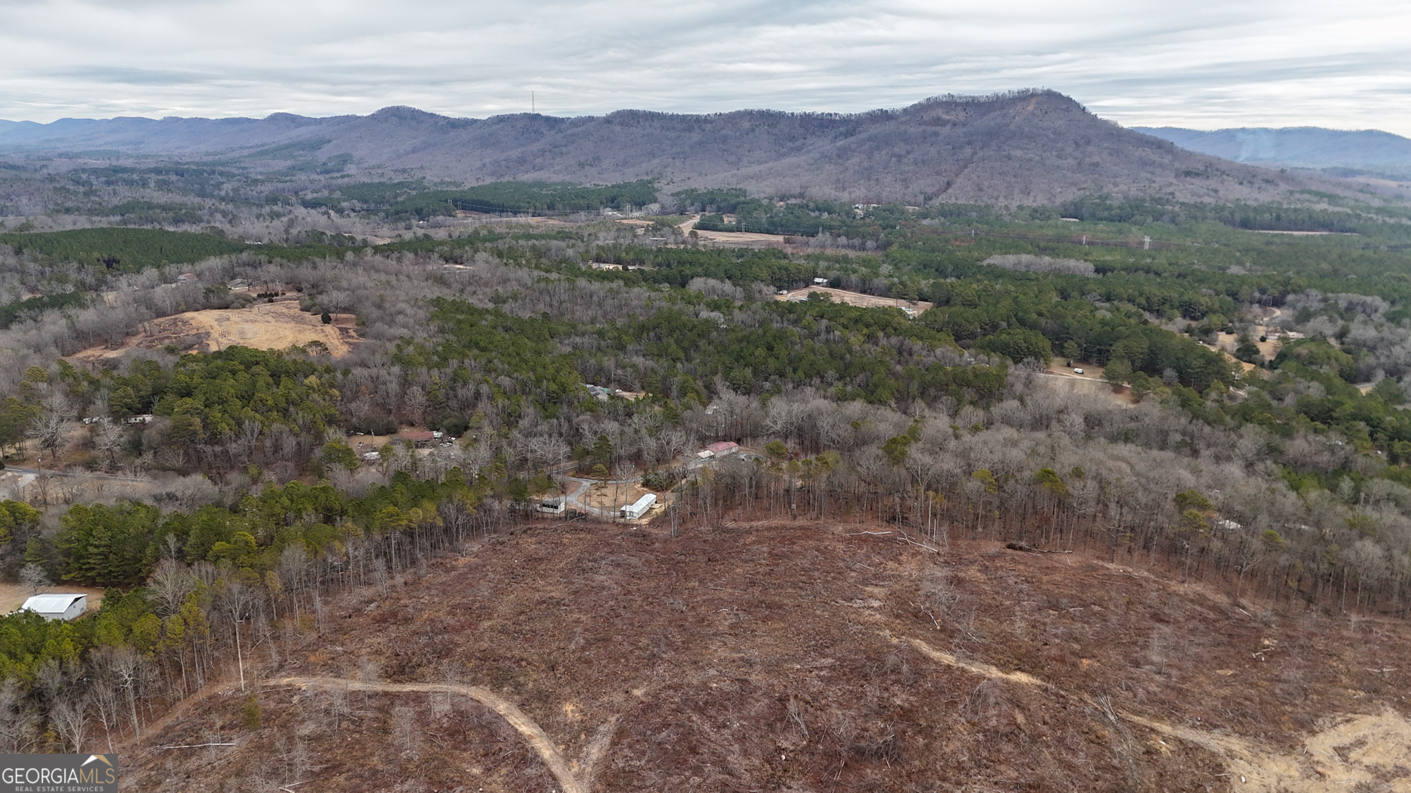 557 Acres On Taliaferro Springs Road Lyerly, GA 30730 - Photo 3 of 15 an aerial view of residential house and green space
