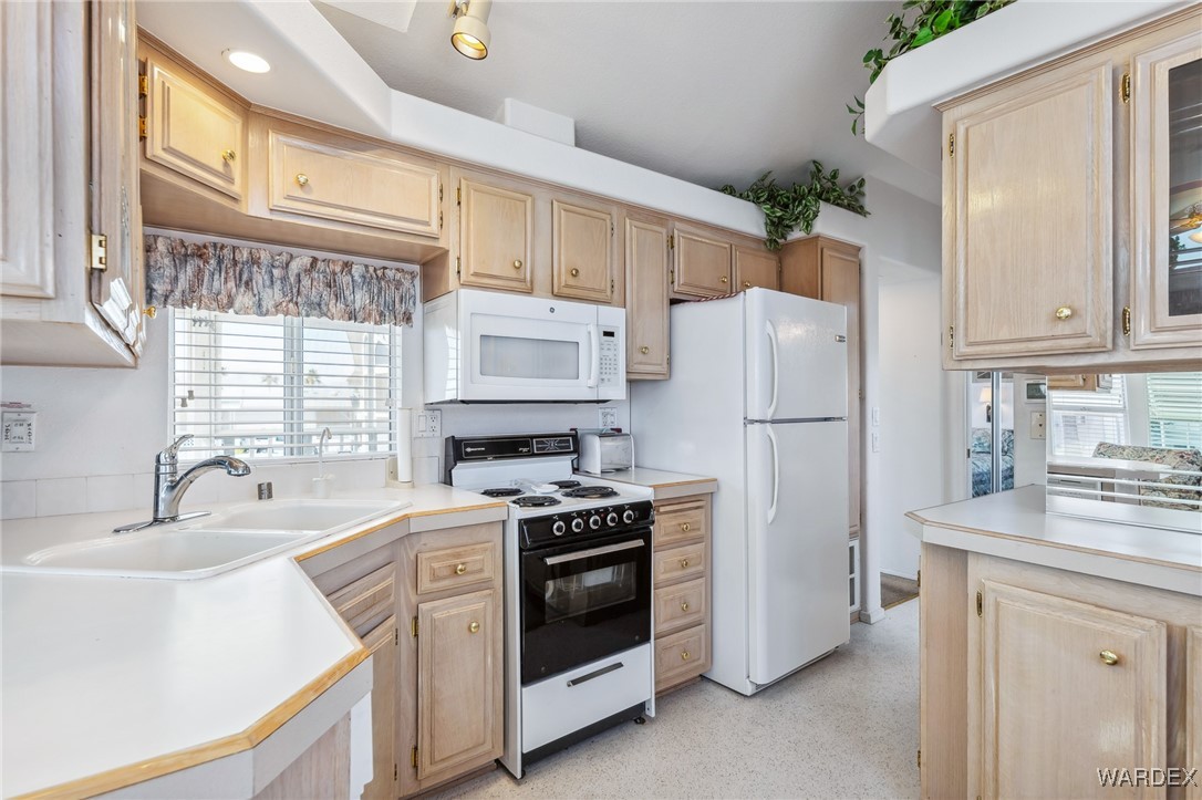 2000 Ramar Road, Unit 211 Bullhead City, AZ 86442 - Photo 11 of 57 Functional kitchen with ample cabinet space and appliances included.