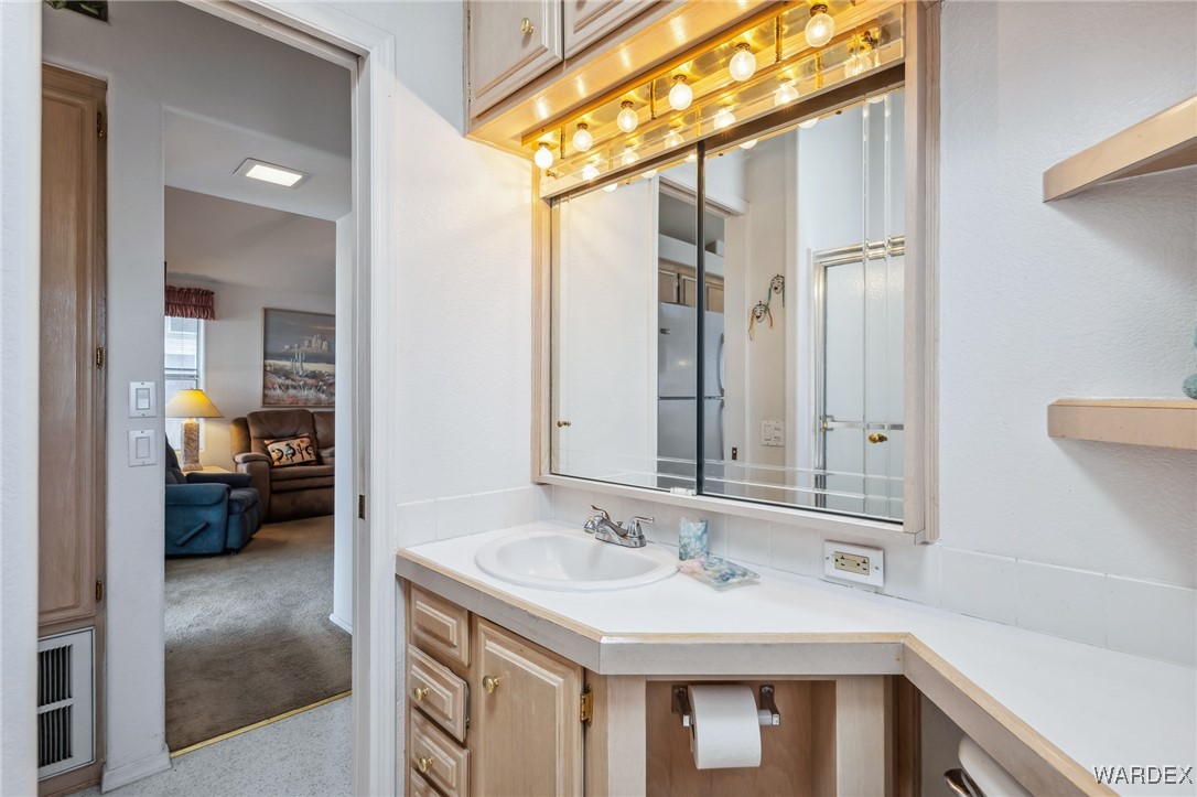 2000 Ramar Road, Unit 211 Bullhead City, AZ 86442 - Photo 17 of 57 Updated vanity area with good lighting and cabinet space.