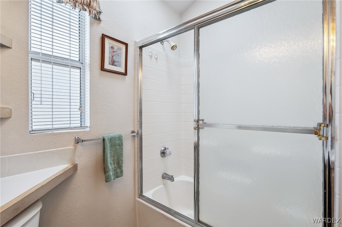 2000 Ramar Road, Unit 211 Bullhead City, AZ 86442 - Photo 18 of 57 Walk-in shower with glass enclosure and clean finishes.