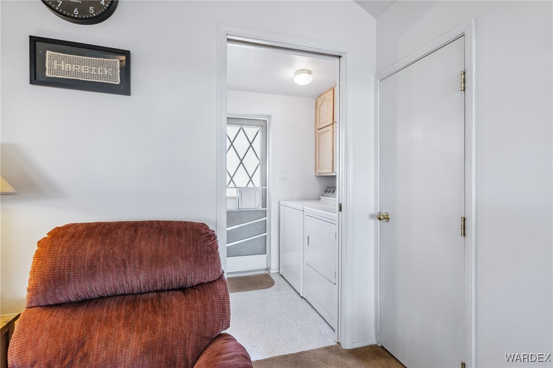 2000 Ramar Road, Unit 211 Bullhead City, AZ 86442 - Photo 23 of 57 Laundry room off of living area with door to the backyard.