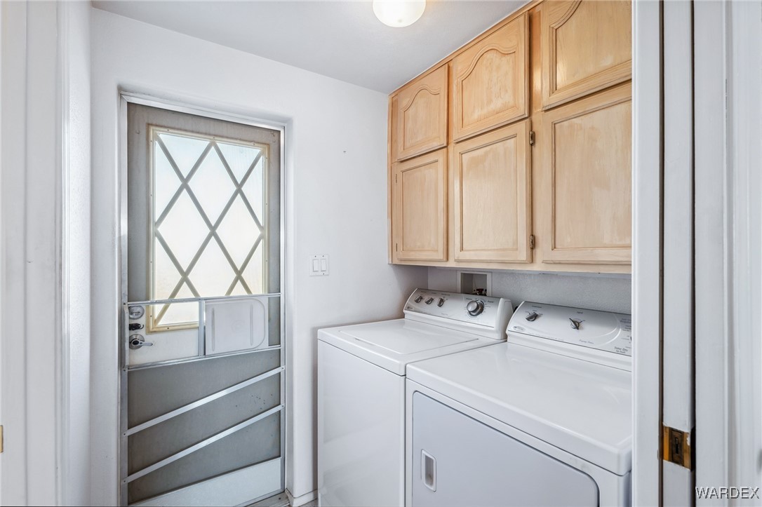 2000 Ramar Road, Unit 211 Bullhead City, AZ 86442 - Photo 24 of 57 Dedicated laundry area with storage cabinets.