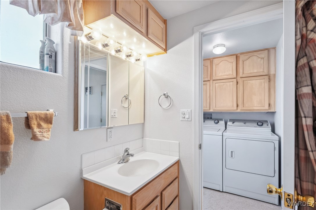 2000 Ramar Road, Unit 211 Bullhead City, AZ 86442 - Photo 26 of 57 Bathroom vanity with good lighting and storage.