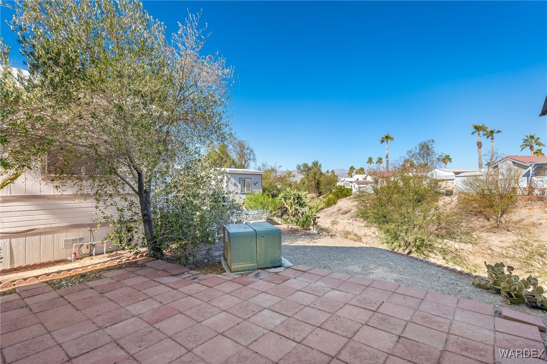 2000 Ramar Road, Unit 211 Bullhead City, AZ 86442 - Photo 32 of 57 Outdoor patio space with desert landscaping.