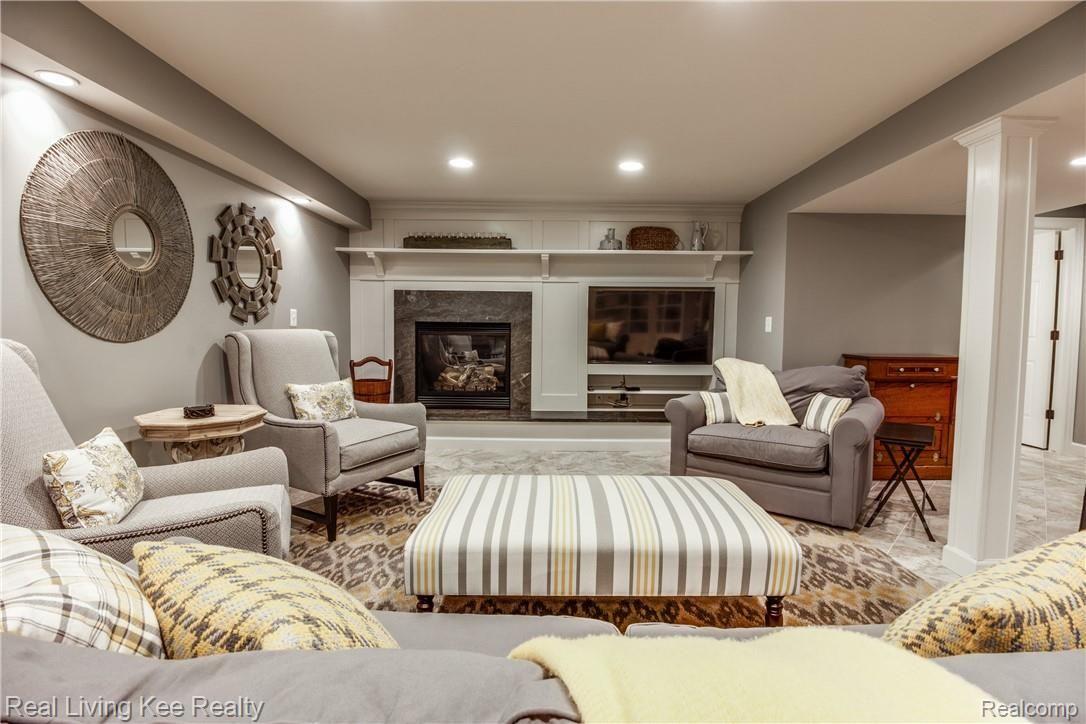 1734 Apple Ridge Court Rochester, MI 48306 - Photo 41 of 56 Lower Level Family Room with Gas Fireplace