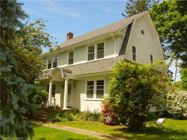172 Neck Road Madison, CT 06443 - Photo 1 of 1 a front view of a house with garden