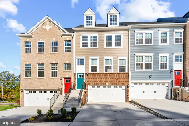 a front view of a building with many windows