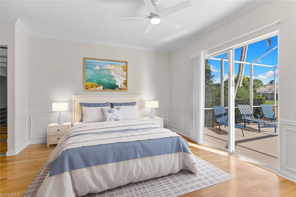 3128 Dominica Way Naples, FL 34119 - Photo 15 of 45 a bedroom with a large bed and a large window