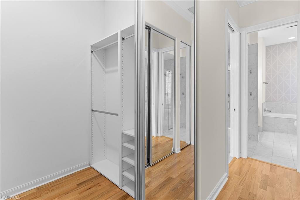 3128 Dominica Way Naples, FL 34119 - Photo 18 of 45 a view of a bathroom with a tub and shower