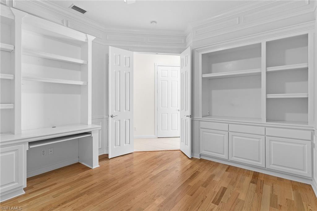 3128 Dominica Way Naples, FL 34119 - Photo 24 of 45 a view of an empty room with cabinet and a window