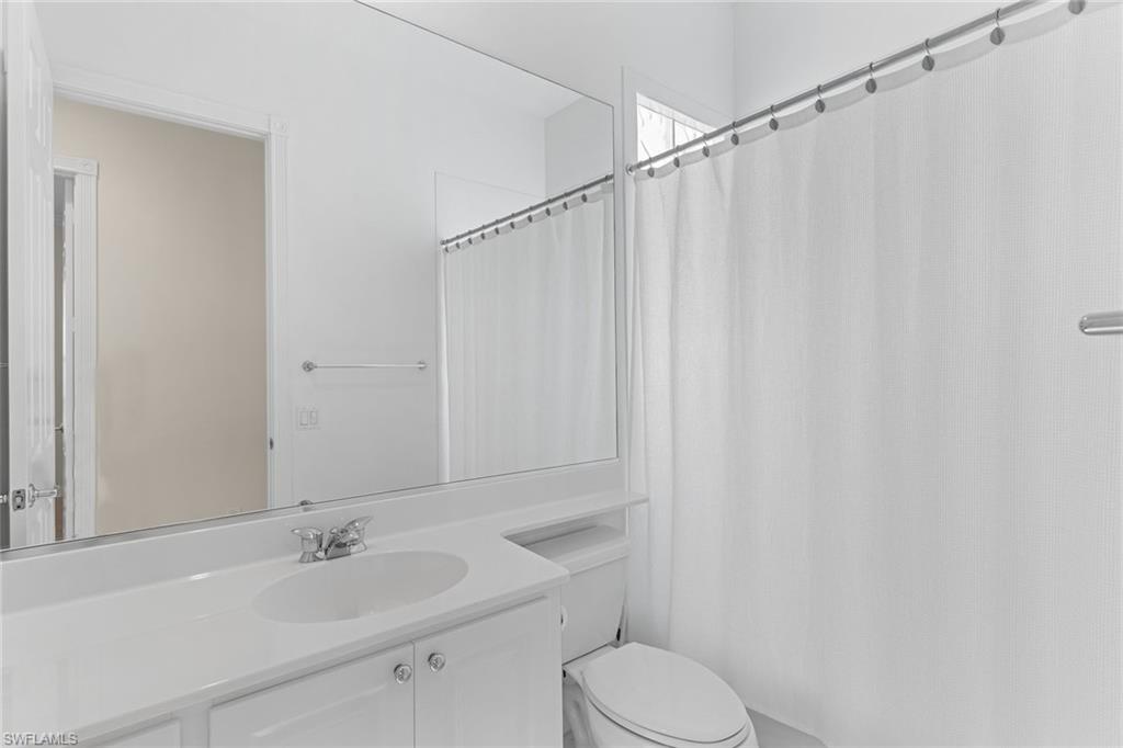 3128 Dominica Way Naples, FL 34119 - Photo 26 of 45 a bathroom with a sink toilet and shower