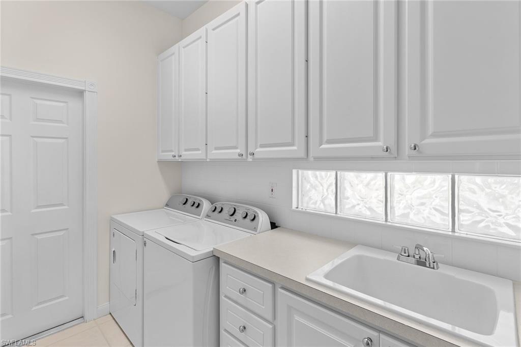 3128 Dominica Way Naples, FL 34119 - Photo 28 of 45 a bathroom with a sink and a window