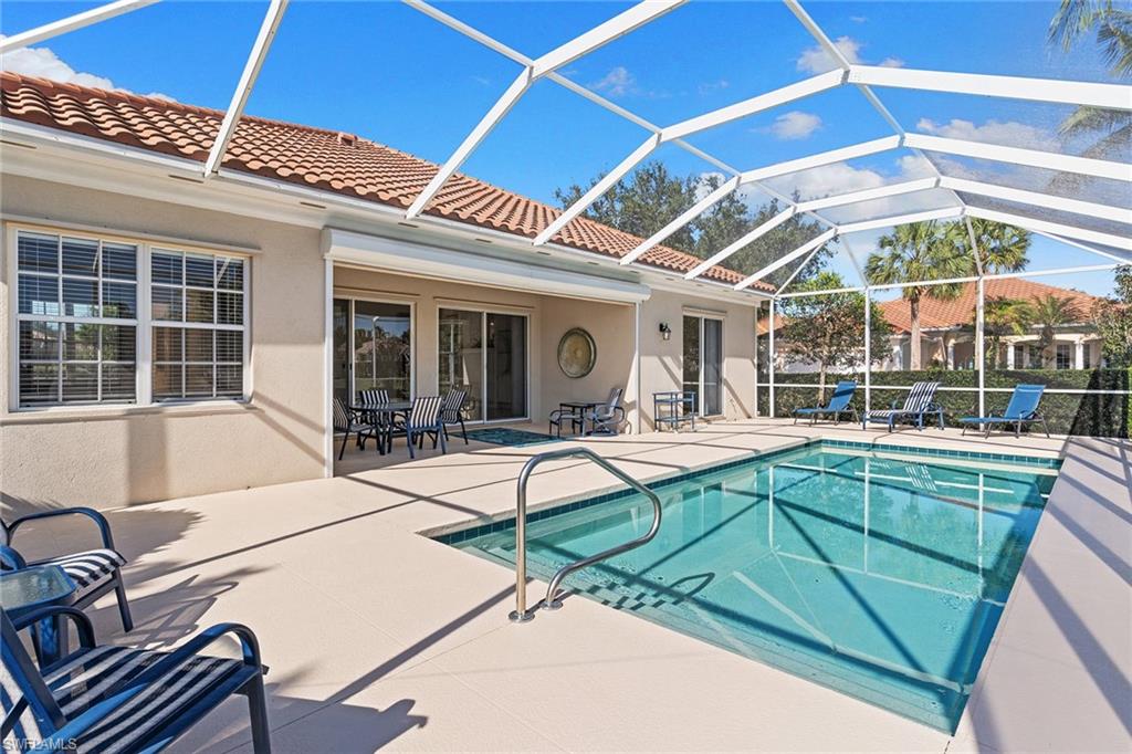 3128 Dominica Way Naples, FL 34119 - Photo 34 of 45 a view of a house with backyard and sitting area