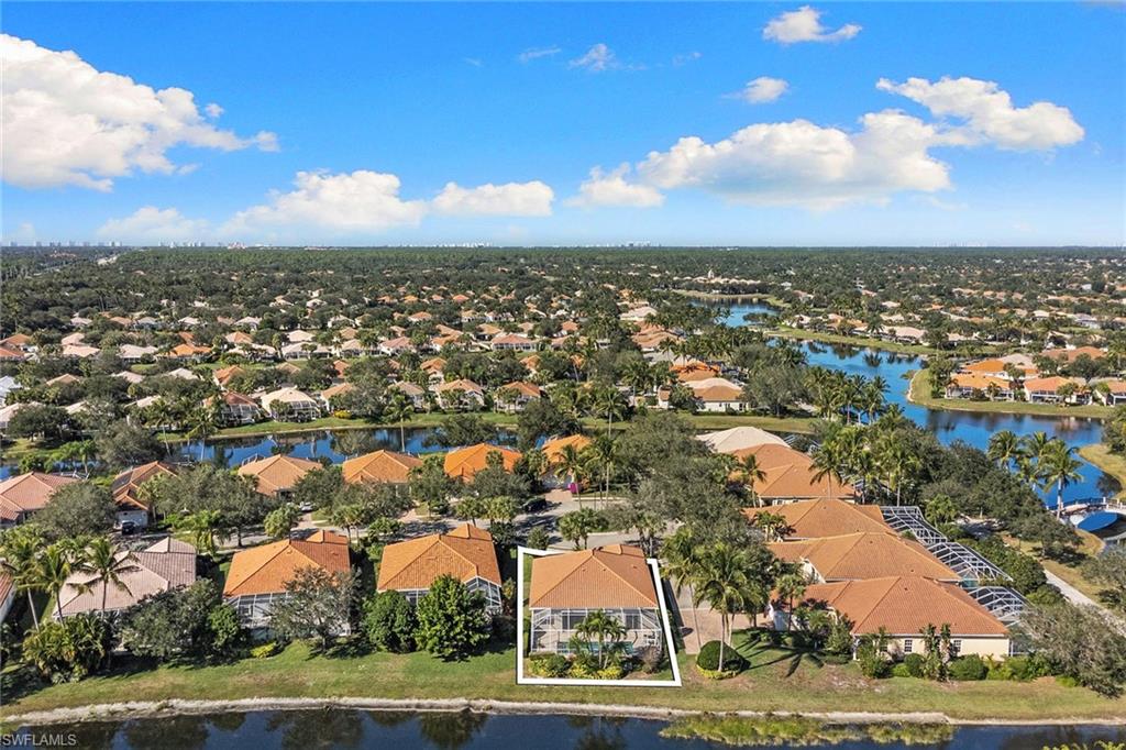3128 Dominica Way Naples, FL 34119 - Photo 37 of 45 an aerial view of residential houses with outdoor space and trees