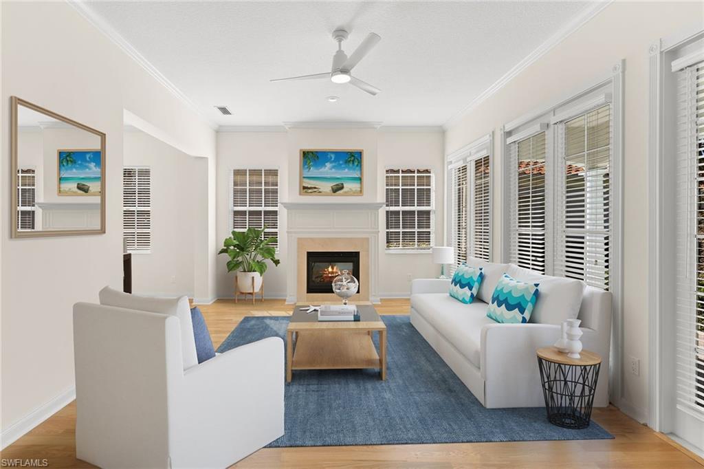 3128 Dominica Way Naples, FL 34119 - Photo 4 of 45 a living room with furniture and a fireplace