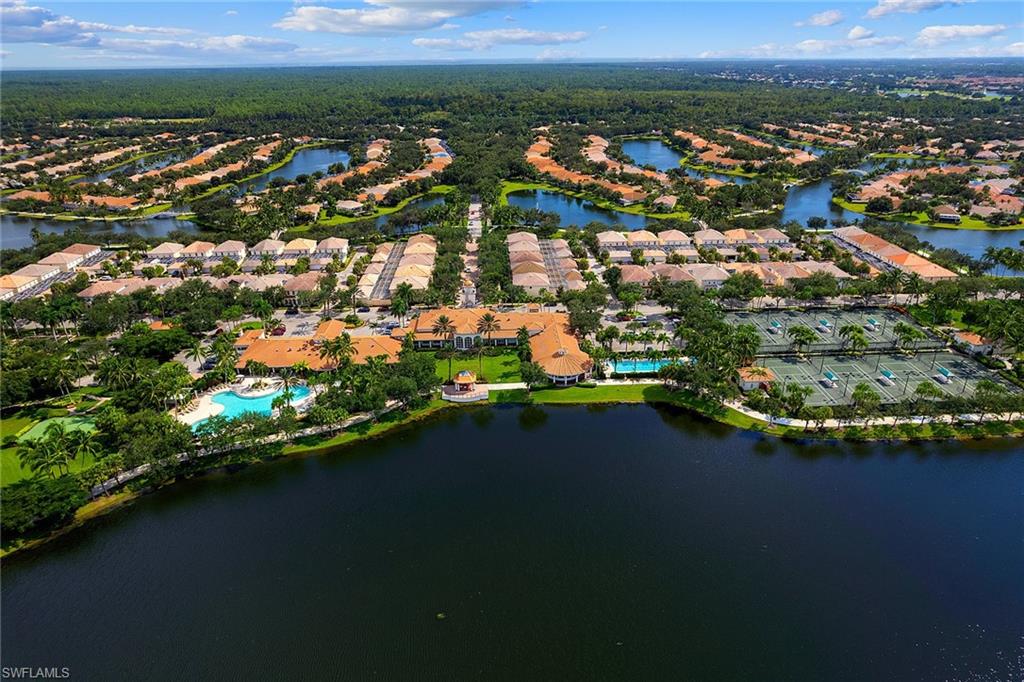 3128 Dominica Way Naples, FL 34119 - Photo 43 of 45 an aerial view of residential houses with outdoor space and trees
