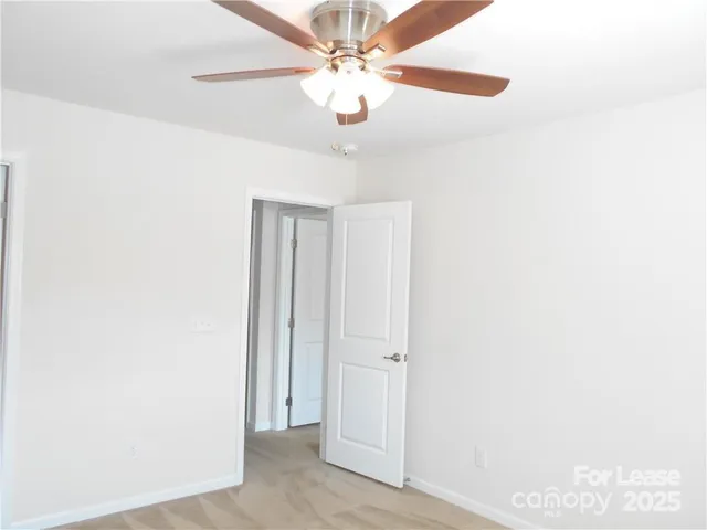 a view of a chandelier fan in a room