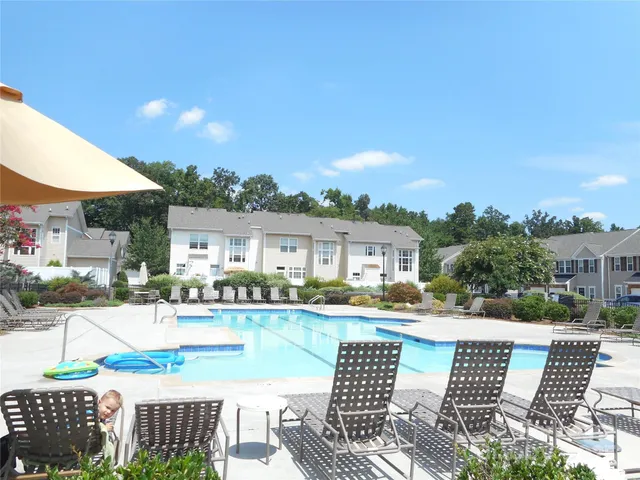 a view of house with outdoor space and seating area