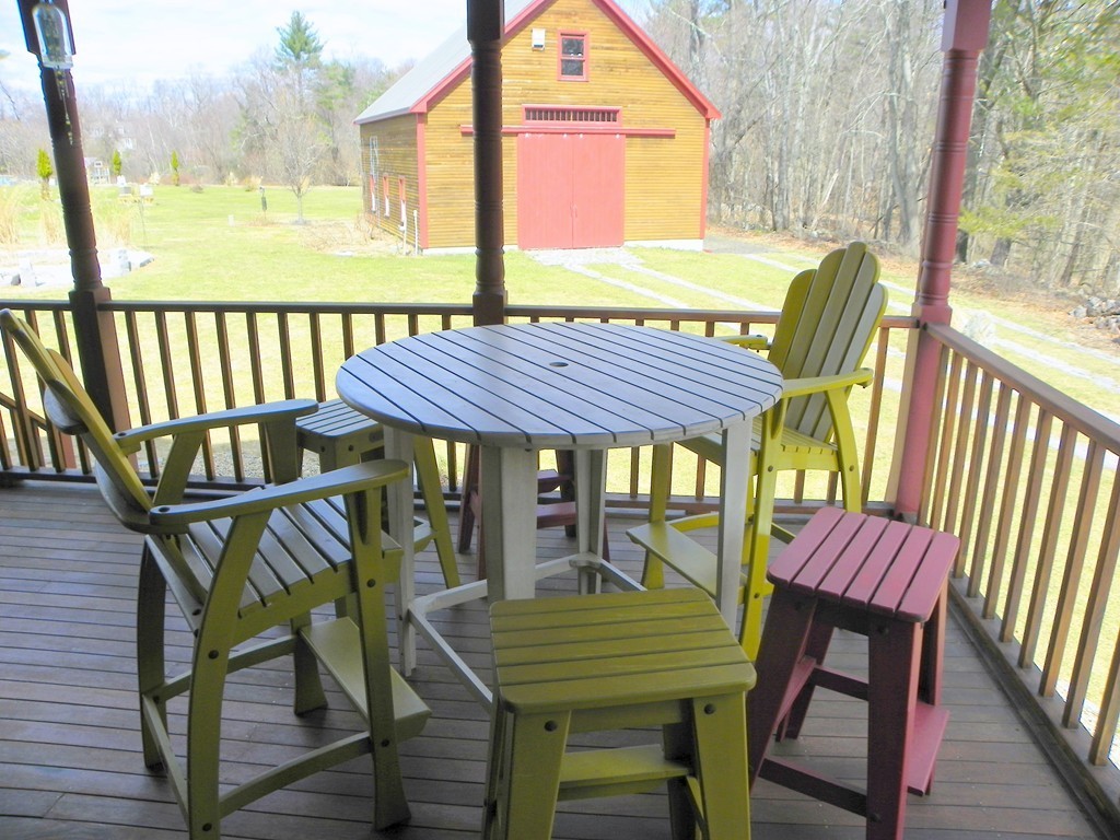 31 Highland Road Merrimac, MA 01860 - Photo 4 of 28 a view of a two chairs with the deck