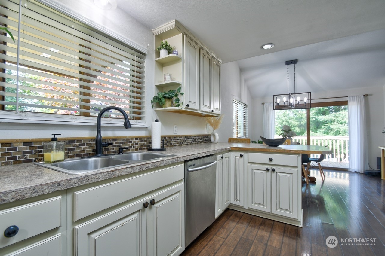 3110 Zenkner Valley Road Centralia, WA 98531 - Photo 11 of 40 a kitchen with a sink window and cabinets