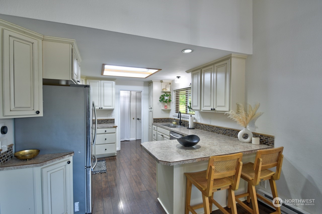 3110 Zenkner Valley Road Centralia, WA 98531 - Photo 13 of 40 a kitchen with stainless steel appliances granite countertop a sink and a refrigerator
