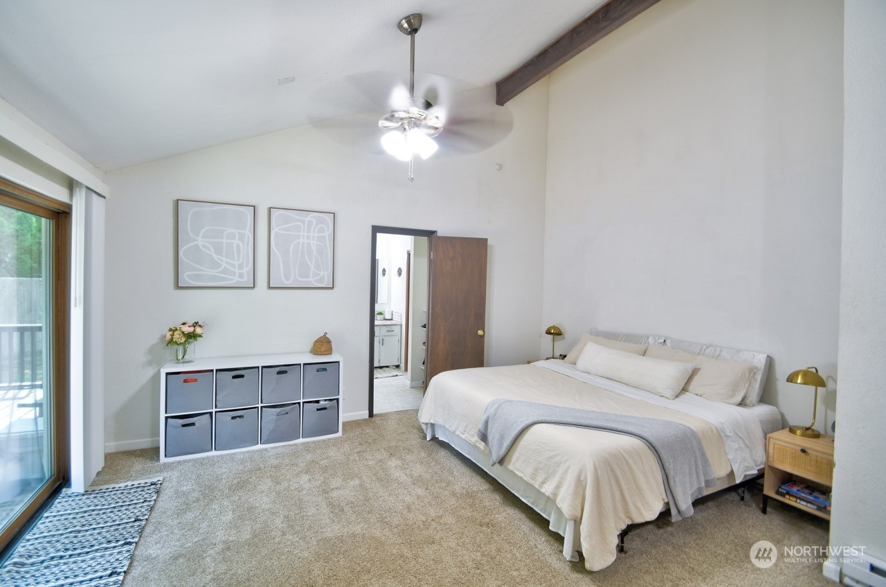 3110 Zenkner Valley Road Centralia, WA 98531 - Photo 19 of 40 a bedroom with a large bed and a chandelier