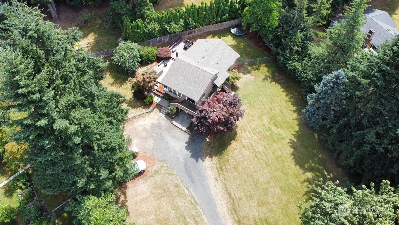 3110 Zenkner Valley Road Centralia, WA 98531 - Photo 2 of 40 an aerial view of a house with swimming pool and large trees